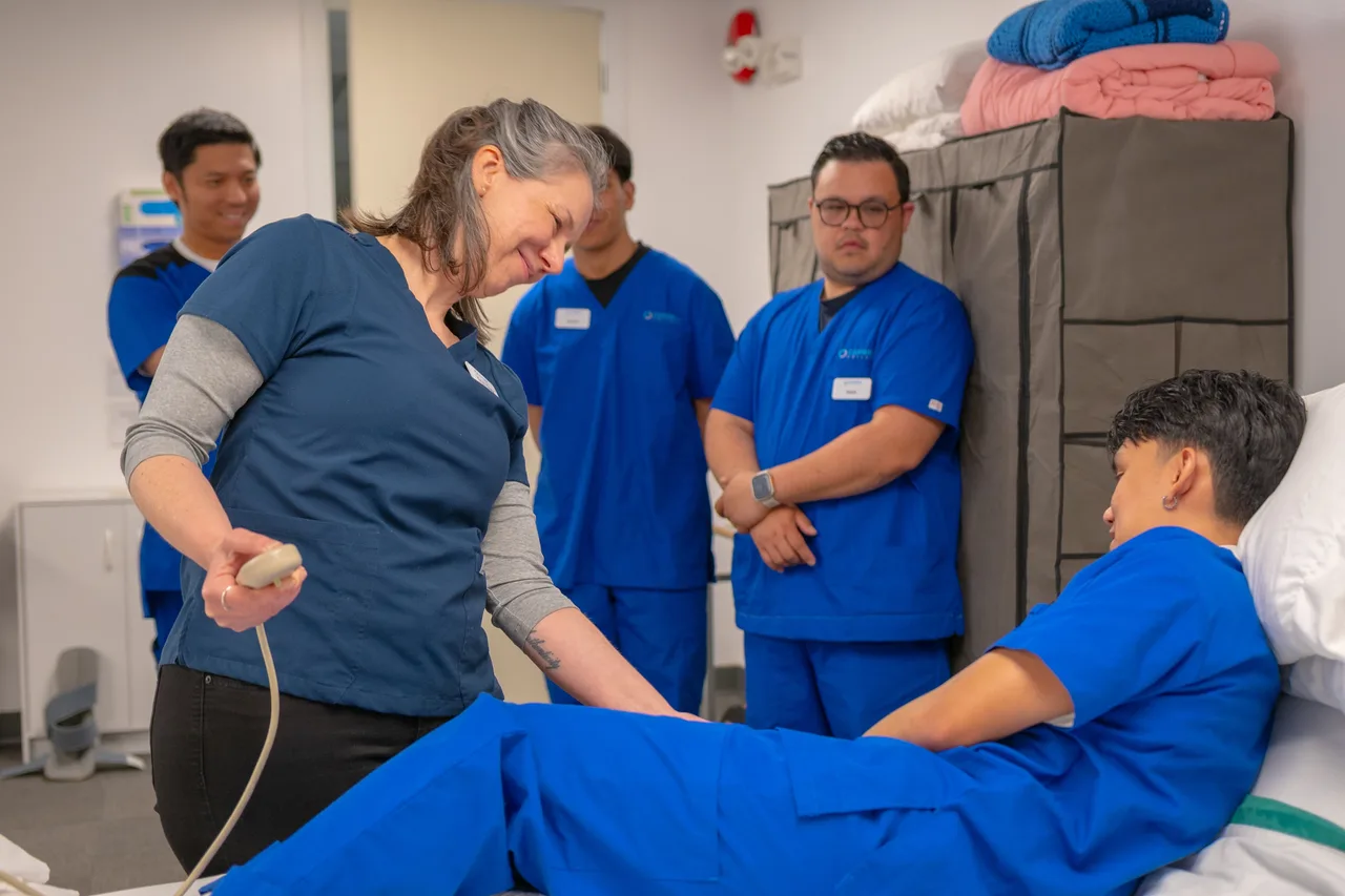 Healthcare professionals observing a clinical equipment demonstration